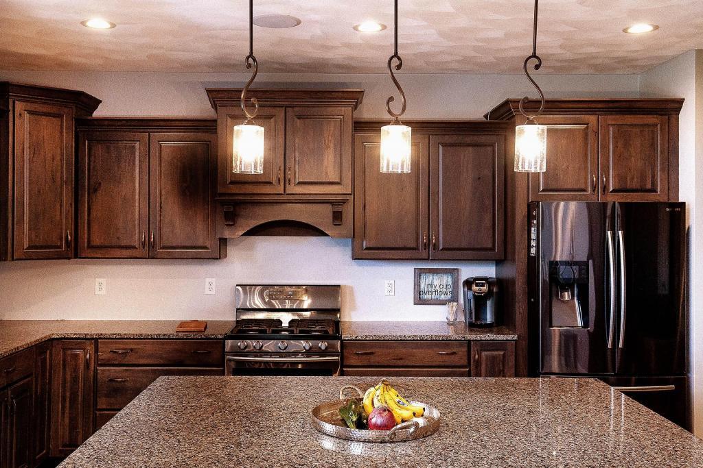 kitchen with dark wood cabinets and custom backsplash