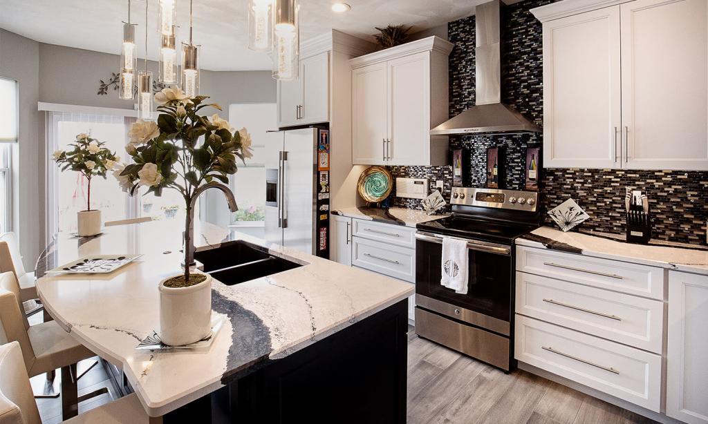 kitchen with white cabinets and black and white granite black tile backsplash