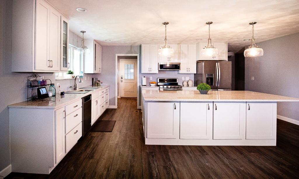 kitchen with white cabinets and tan quartz counters