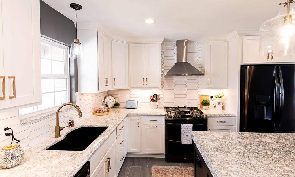 custom kitchen with white cabinets and quartz counters