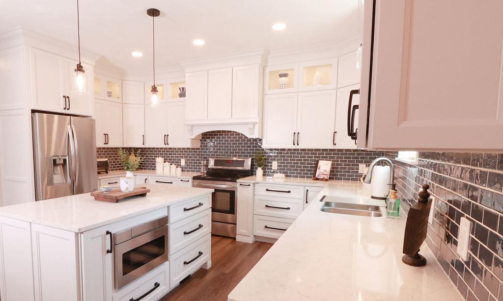Kitchen with modern white cabinets and tile backsplash