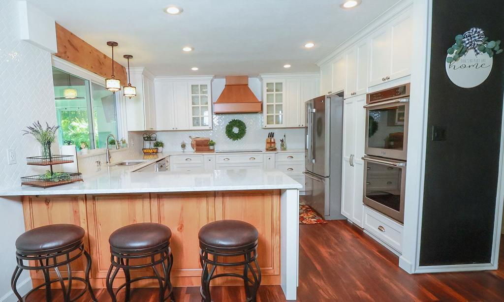 Kitchen with modern white cabinets and tile backsplash