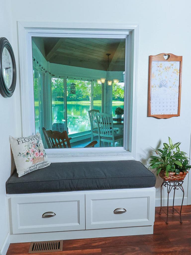 Living room sitting area built in cubby with blue cushion