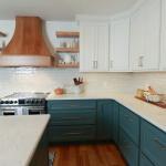 New kitchen with green cabinets and white counters