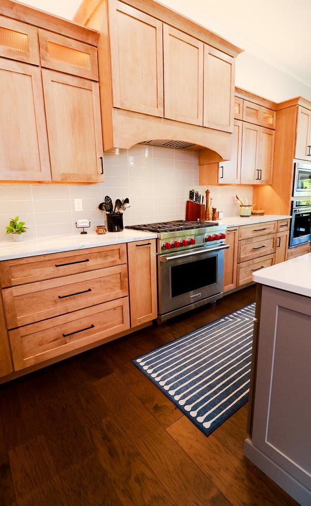 modern kitchen with wolf stove and oak cabinets