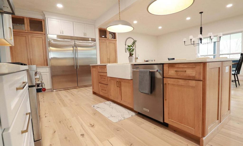 oak cabinets with light wood flooring