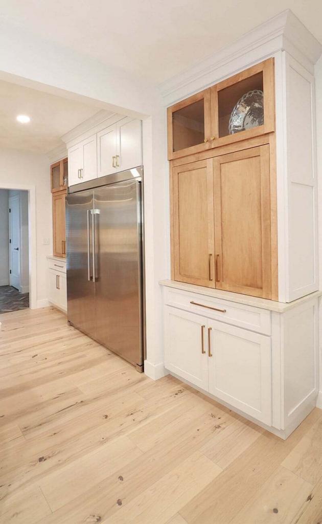 modern kitchen with oak and white cabinets