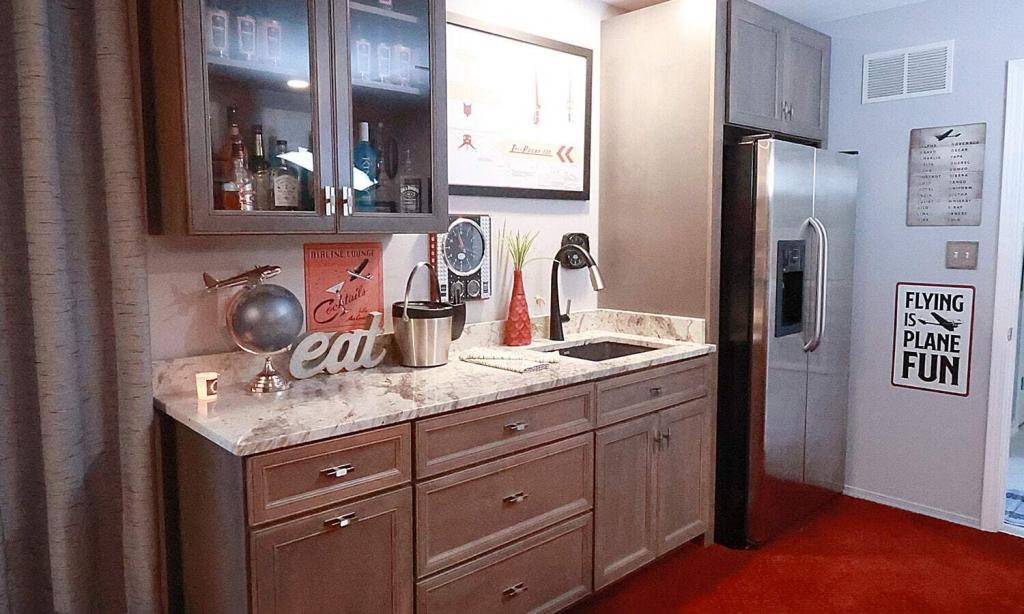 red carpet with neutral cabinets