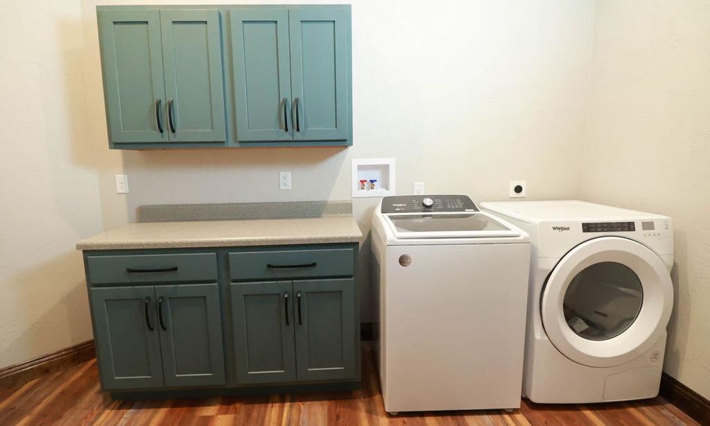 green cabinets in laundry room