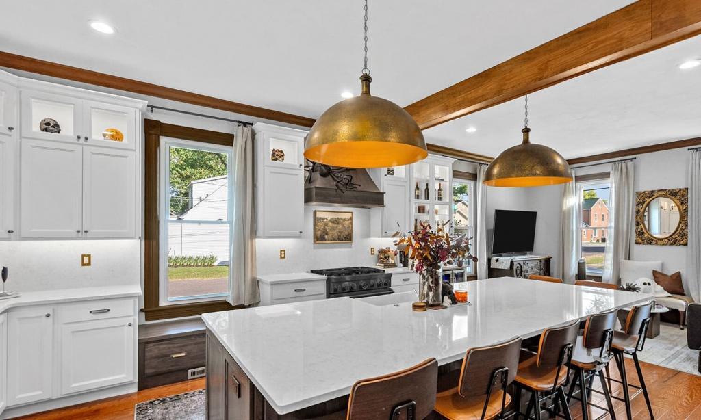 modern white kitchen with metal lights